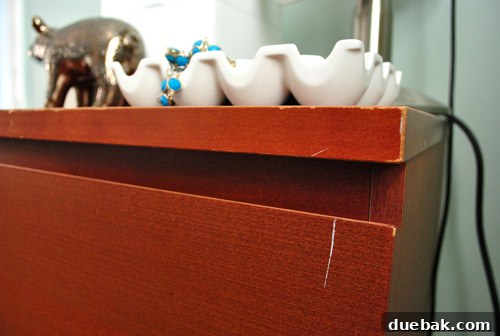 Close-up of old Malm dresser with visible wear