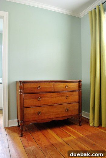 Bedroom view showing the dresser and rustic floors