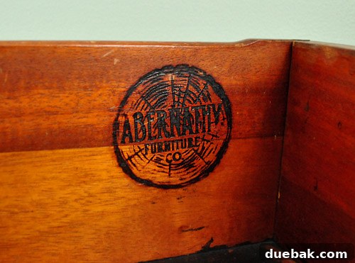 Close-up of the Abernathy Furniture Co. stamp on the dresser