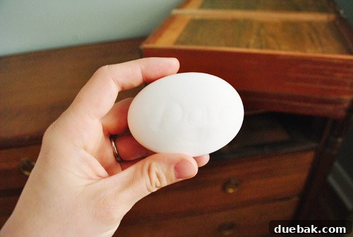 Sherry rubbing soap on a drawer rail
