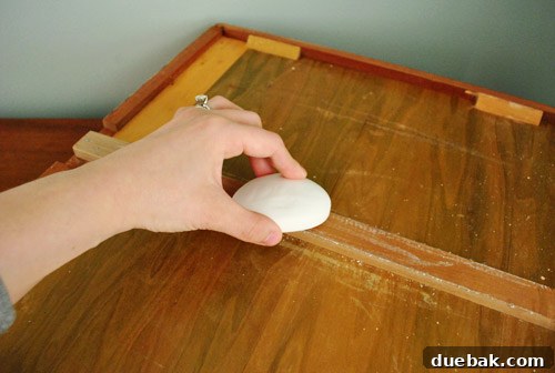Close-up of soap application on the bottom of a dresser drawer