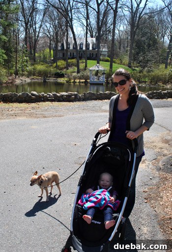 Author enjoying a sunny walk with her family in a beautiful neighborhood