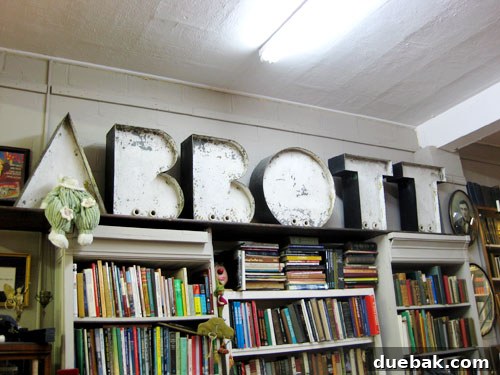 An antique art deco sign featuring large, stylized letters A, B, O, T.