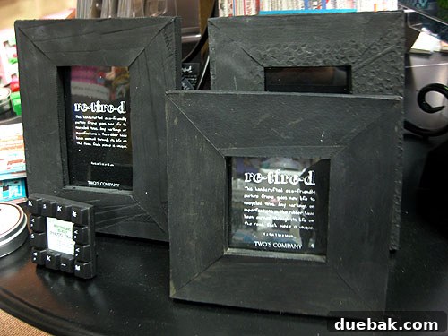 A close-up of unique picture frames made from recycled tires, showcasing their textured, matte finish.