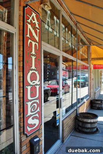 Inside an antique shop in Old Central City, showcasing shelves filled with various vintage items.