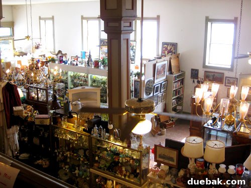 Another interior view of an antique shop, featuring a wide assortment of collectibles and furniture.