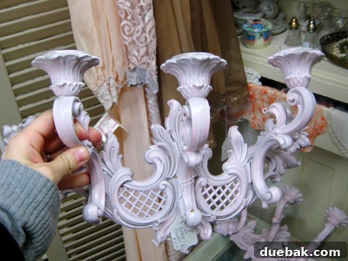 Ornate white antique candle sconces, perfect for a DIY color transformation project.