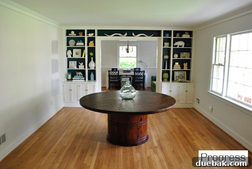 Transformed dining room looking into the new home office with painted built-ins and shelves