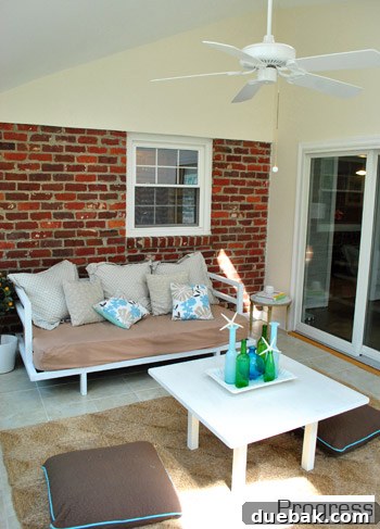 Another current view of the sunroom, showing potential for unification through paint