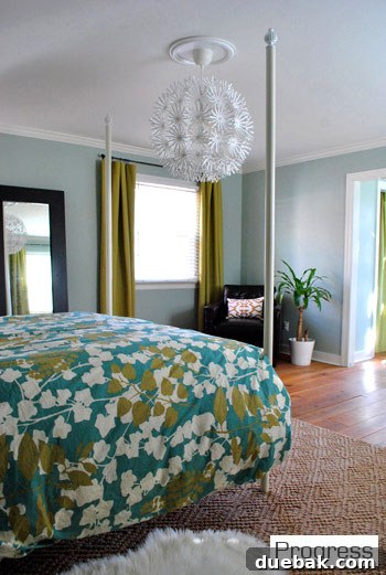Third perspective of the master bedroom, highlighting the new light fixture and overall ambiance