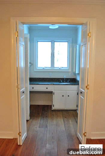 Master sink nook before renovation, showing its visible location from the bed