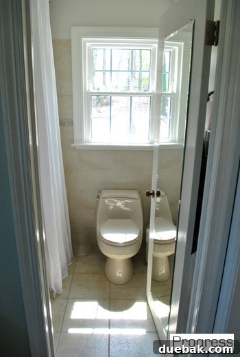 Another current view of the master bathroom, highlighting its untouched state