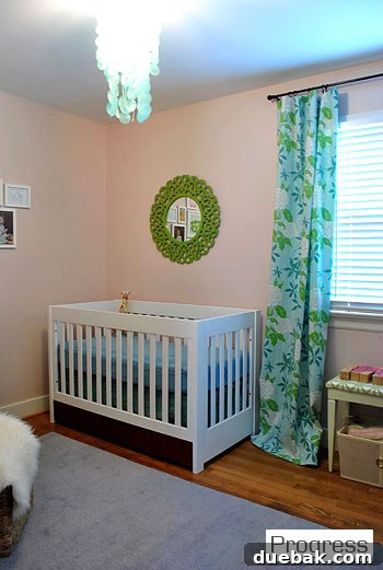 Clara's nursery now, with soft lavender-pinky-gray walls and hung art