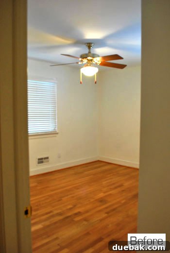 Middle bedroom designated as the playroom, empty on move-in day