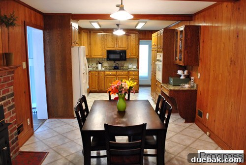 Current state of the kitchen, showing a temporary table and plans for a large island