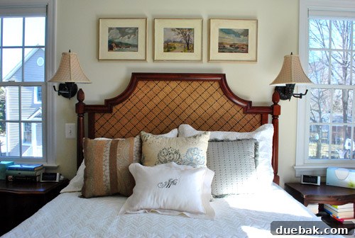 Main bedroom featuring a bed with exotic vacation-inspired decor