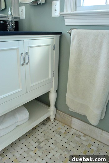 Close-up of elegant marble basketweave tile flooring in a master bathroom