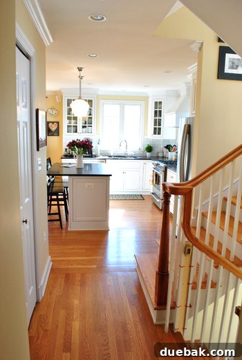 Elegant hallway in a Northern Virginia home leading to a modern kitchen