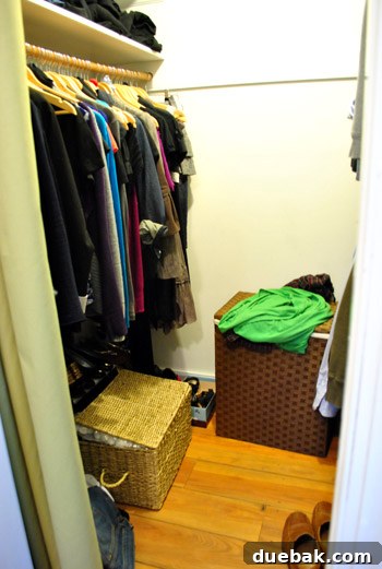 Disorganized closet with clothes piled in cubbies