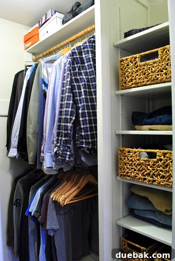 John's side of the closet after organization, hanging shirts