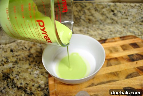Transform Your Upholstery With Fabric Paint Medium 8 Mixing latex paint and fabric medium in a bowl with a brush
