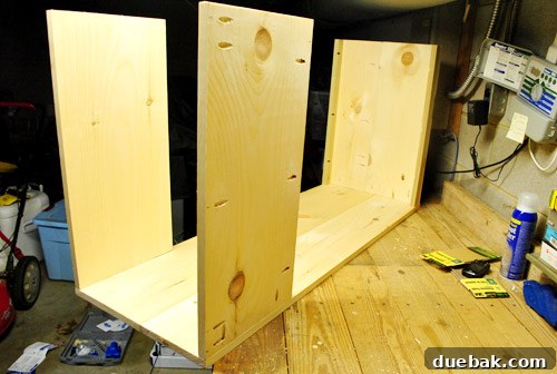 Console shelf back panel attached with holes on hidden side