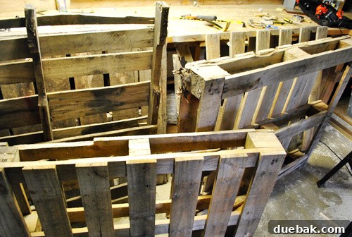 Pallets drying out in a basement workshop before deconstruction
