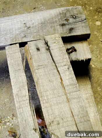 Close-up of cracked pallet wood plank after failed deconstruction attempt