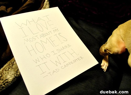 Framed handwritten quote by Tad Carpenter with dog's paw