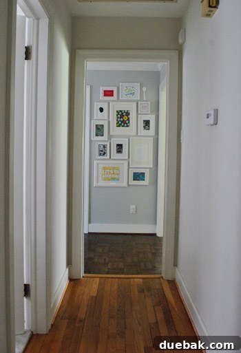 View of the completed hallway gallery wall from a distance