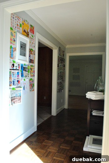 Hallway gallery wall with central large frame as anchor