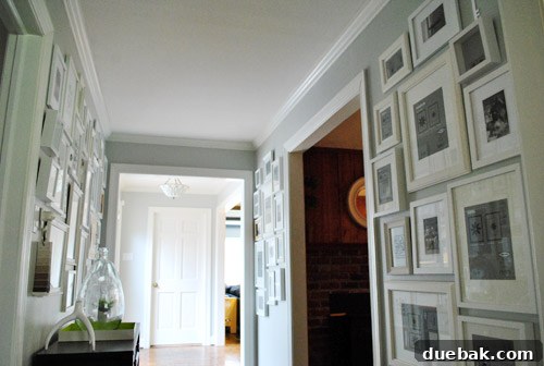 Another angle of empty frames on hallway gallery wall