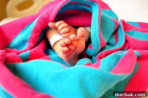 Clara wrapped in a blanket