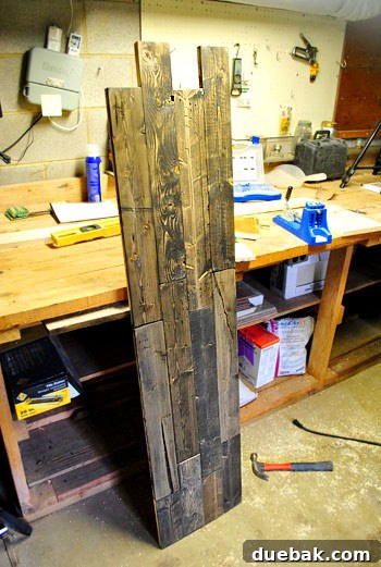 Partially completed console tabletop, showing the varied wood tones and textures, awaiting its perimeter border.