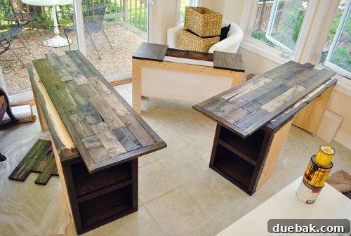 Touch-up staining and polyurethane application on the console tabletop components, including the storage piece.