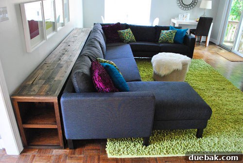The impressive 12-foot DIY console table fully assembled in the living room, showcasing its grandeur.