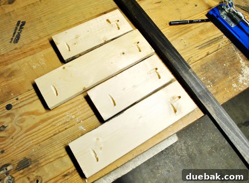 John using a Kreg Jig to drill pocket holes into a stained wood board, a crucial step for tight joinery.