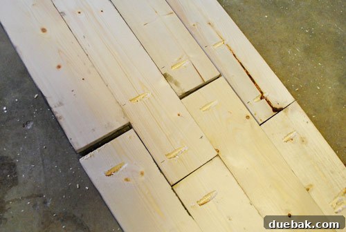 Assembled section of the distressed wood console tabletop, showing joined boards before the poplar border is added.