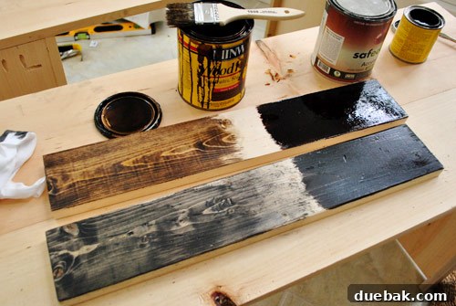 Test boards showing various stain finishes on scrap wood pieces, evaluating light vs. heavy coats to achieve the optimal old reclaimed look.