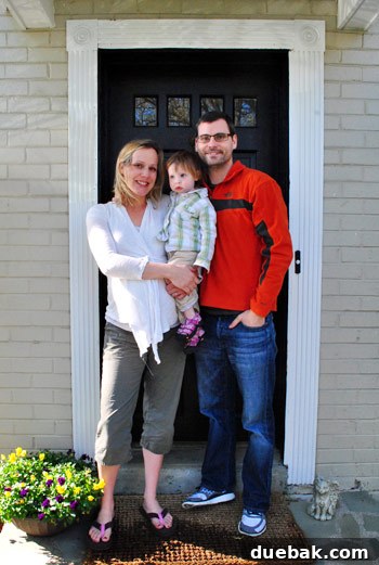 Gift the Canvas of Imagination 13 Travis, Cat, and their daughter Elsa smiling together in their new home.
