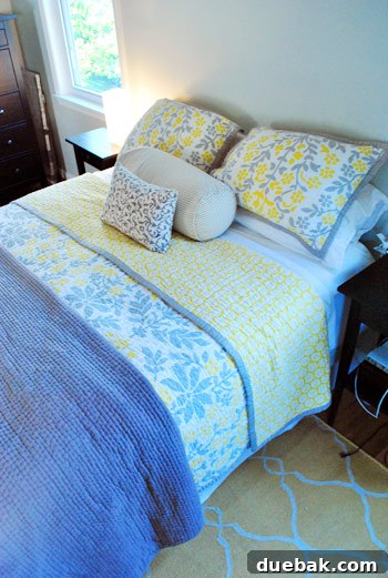 Gift the Canvas of Imagination 14 A stylish bedroom with yellow and gray bedding and a yellow rug.