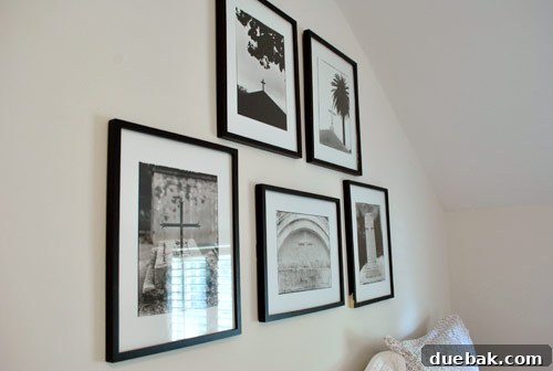 Gift the Canvas of Imagination 17 A gallery wall taking shape with multiple frames being hung.