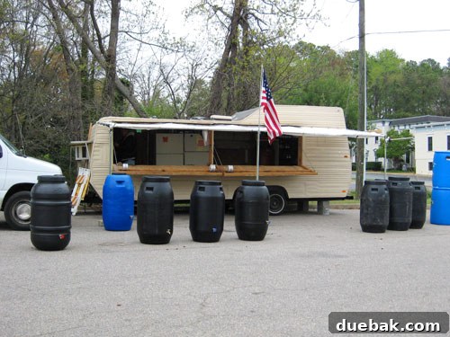 Easy Rain Barrel Setup 3 Rustic roadside stand selling produce and barrels