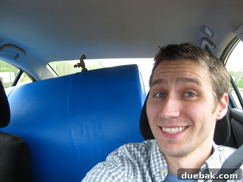 Easy Rain Barrel Setup 4 Blue 55-gallon rain barrel in the backseat of a car