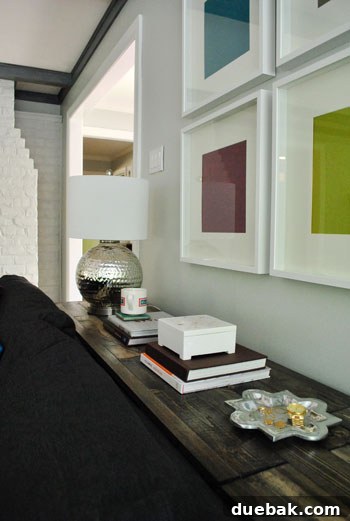 View of the console's top surface with various personal decor items arranged.
