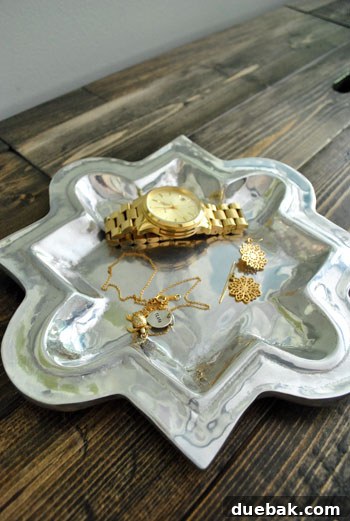 A thrifted quatrefoil tray on the console table, ready for jewelry.