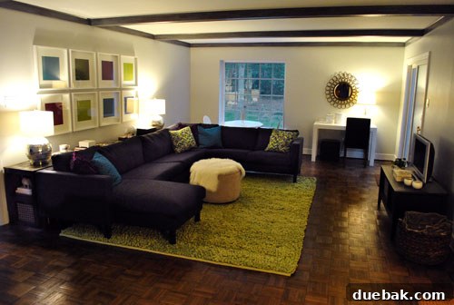 Living room at night, illuminated by the console table lamps, creating a cozy atmosphere.
