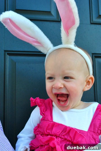 Easter Steals 2 Clara, wide-eyed with wonder, holding her first two Easter eggs