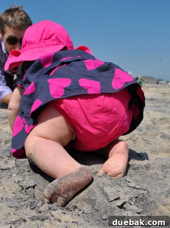 Easter Steals 19 Clara crawling joyfully across the sandy beach, fully embracing the environment