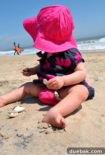 Easter Steals 20 Clara, bundled and curious, looking out at the ocean for seashells or surfers